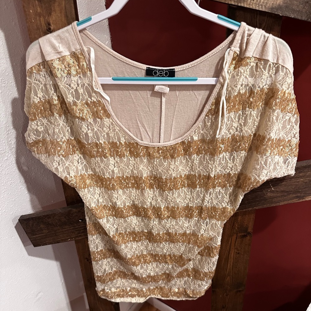 Cream colored lace and gold sequence stripped top. Size small